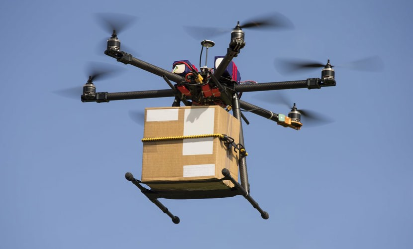 an image of a drone delivering a parcel in the air