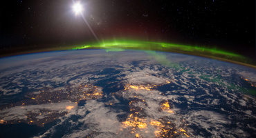 United Kingdom and Scandinavia on a moonlit night under an amazing aurora