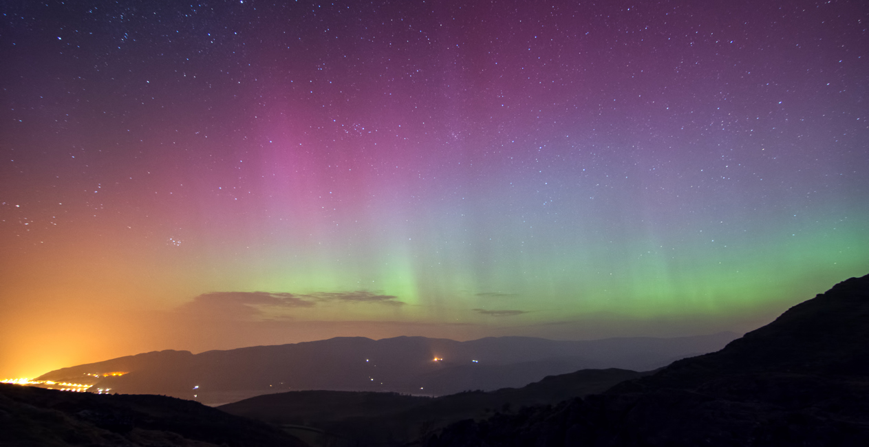 Aurora Borealis visible with the naked eye in Snowdonia overlooking Barmouth Estuary